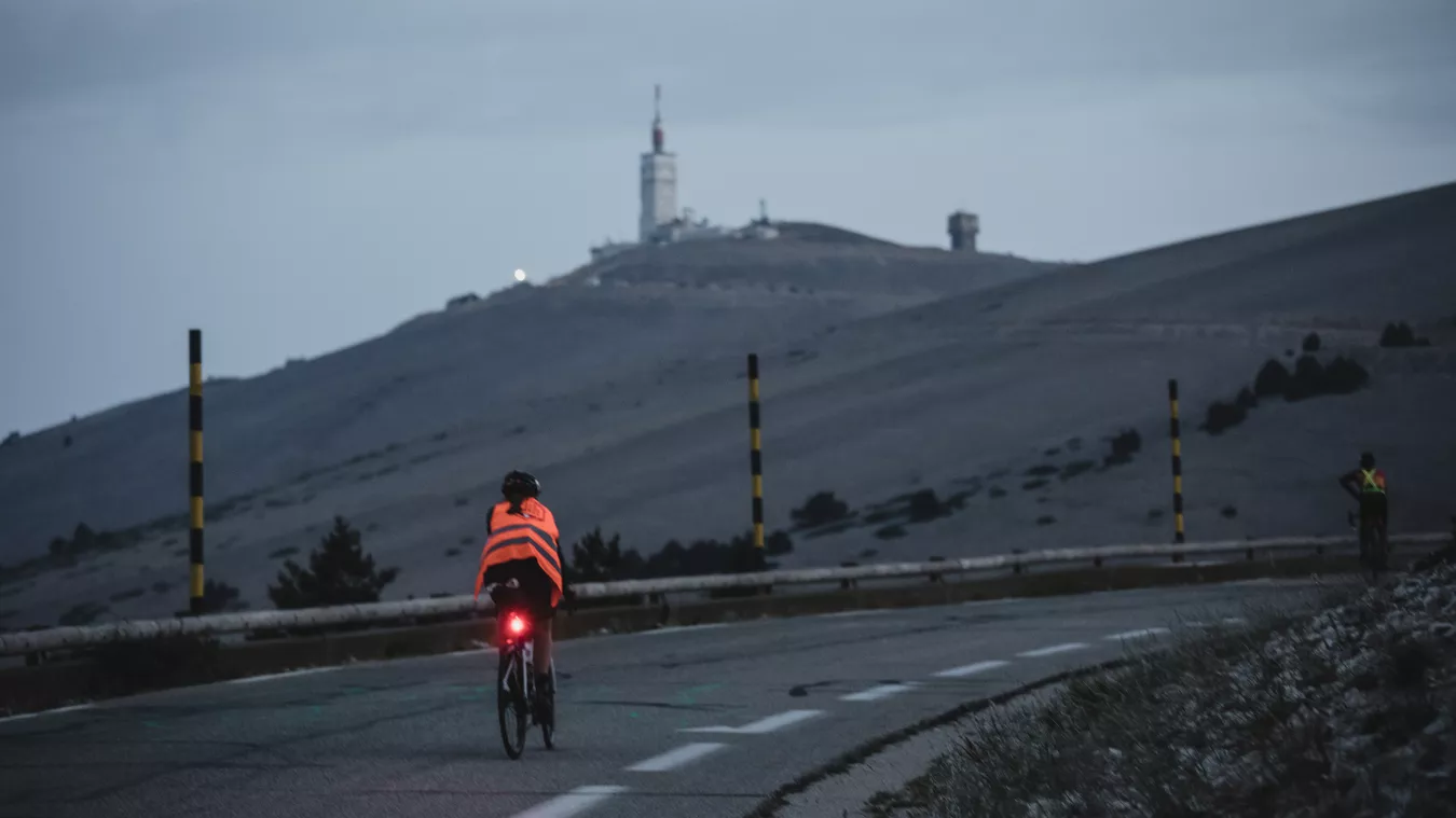 A man riding a Lapierre road bike up a hill