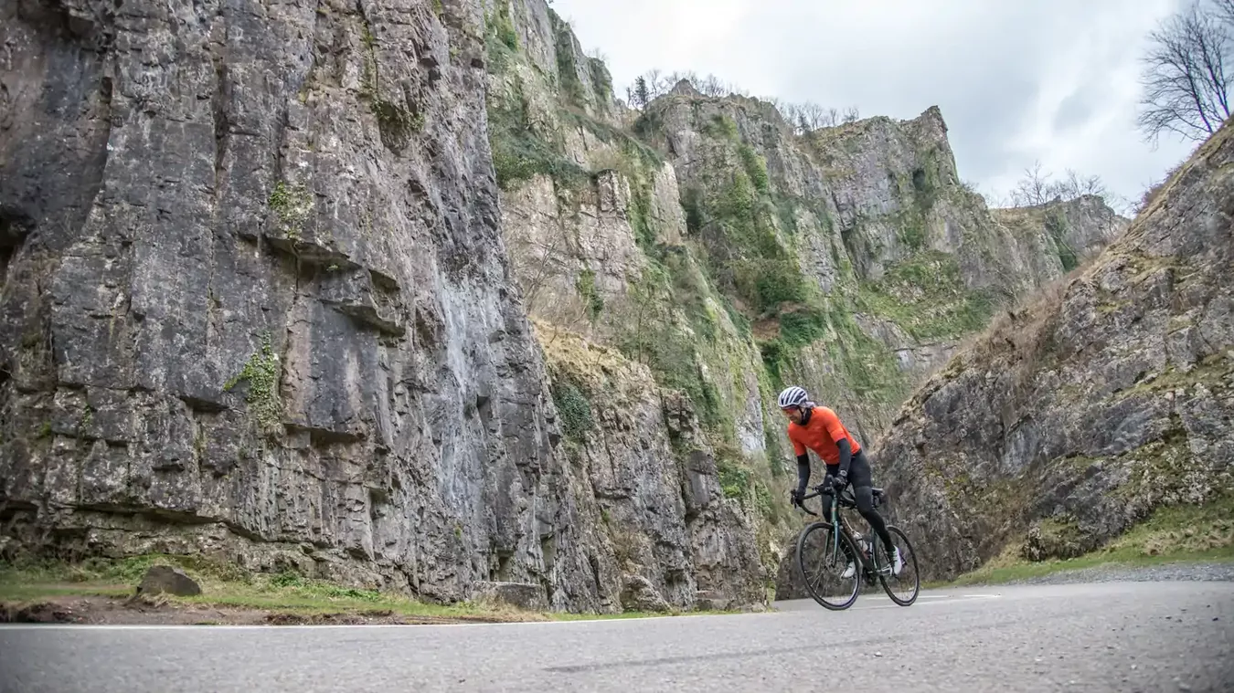 A man riding a Lapierre road bike up a hill