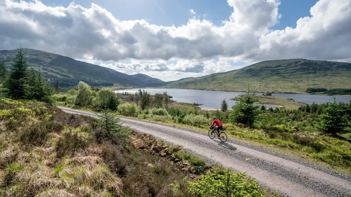 A man riding a Lapierre road bike up a hill